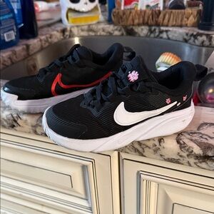 Nike Kids Black Sneakers with White and Red Accents